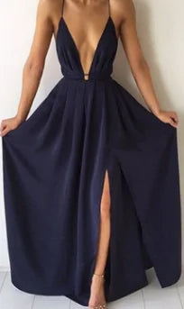 Elegant Natalia Dress with deep neckline and thigh-high slit, showcasing timeless sophistication and versatile chic.