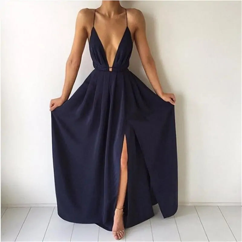 Elegant Natalia Dress with flowing silhouette and deep neckline, perfect for versatile occasions.