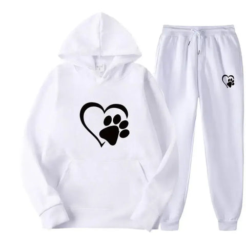 Dog print hoodie and pants set with paw design on white fabric.